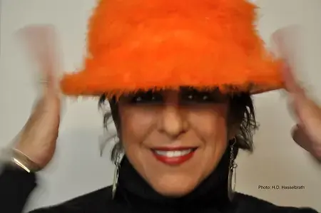 Portrait with orange hat by Holly Dixon. 