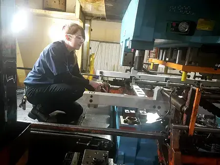 This photo captures working in a stamping press as a Journeyman Tool and Die Maker.