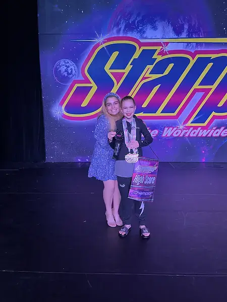 My milestone moment was seeing the shy, underdog kid who was my mini when I was on the competition team later became my student, who blossomed into this talented tap dancer with the cutest personality to match! This was her first big win and between both her ecstatic smile and growing sense of pride her confidence soared!