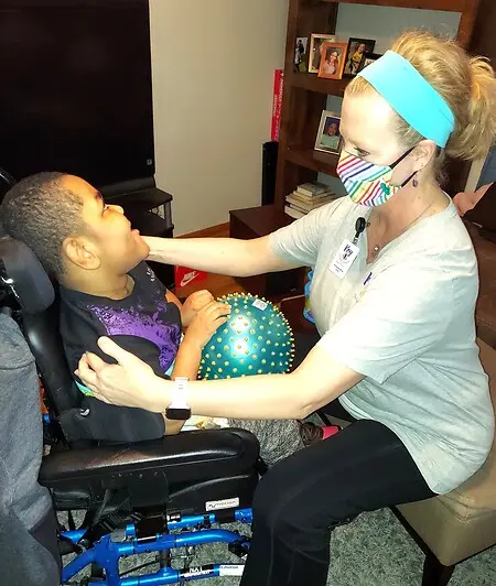 Guiding a young person to move and to learn at home with his new little brother--his favorite occupation.