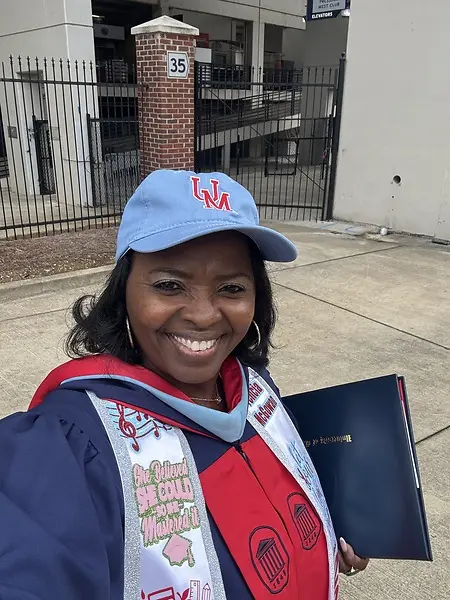 "Captured at the University of Mississippi, this moment represents the completion of my second Master's degree in Education Administration, a journey I chose to pursue even after earning my doctorate. This milestone is a testament to perseverance and faith; despite the challenges, God sustained me. By 'burning the midnight oil' and sacrificing leisure trips and family gatherings, I hope I've shown my children what true determination looks like. These temporary sacrifices have led to a lasting victory, proving that with tenacity, you can push through any hardship to reach your goals."   