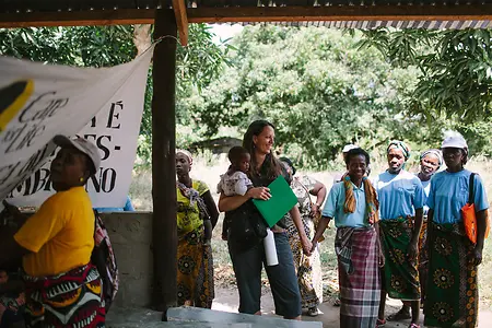 Dr Angie Holzer leading an expedition to Mozambique, and supporting a local charity, Care for Life. 