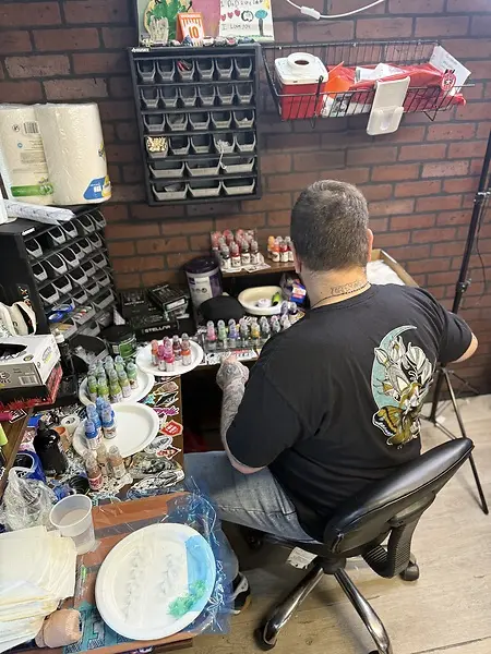 Taking photos to set up for our next client’s tattoo 