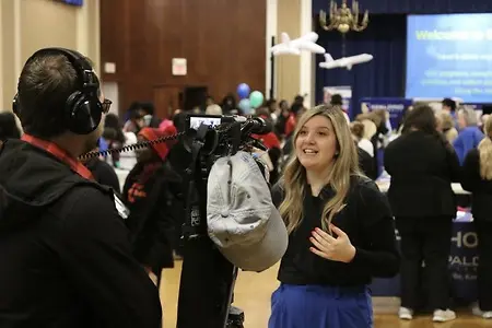 Being interviewed for hosting an creative admissions event.
