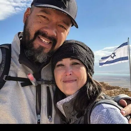 Husband Raymond and I in Israel on a 2020 Pastor and wife mission trip, gifted by our loving congregation. I thought about a self photo depicting a proud moment, but all proud moments have always been by my husband's side. When I struggled as wife, he was there to love me.  I struggled as a mom, he was there to reassure me. I wanted to pursue the medical field and put our youngest in a daycare, and he stood by me. While recovering from a hysterectomy, then started my daycare, he loved to play with the kids during naptime then leave, laughing! He wanted to become a pastor and I stood by him and closed my daycare to work in oil and gas. The company started downsizing for relocation, he said everything will be fine. Got a job with the District Attorney's office and help 4 different positions in almost 5 years. Here is when I became aware of the Crisis Intervention Unit with the Midland County Sheriff's office. and started volunteering in 2021. He knew I wanted to stop volunteering for the Crisis Intervention Unit and apply to be one of 2 paid staff members who are on call 24/7/265, and he said he would stand behind my decision. Almost 31 years together, he knows when I have had a troubled day and he is there to listen. I owe all triumphs to the grace of God and the support of my family. 