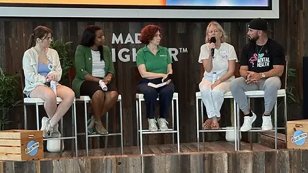 Emma Tropea (on the left) speaking at the Miami Marlins' Mental Health Awareness Night panel 
