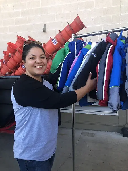 Picking up coats for the annual winter blast event which provides coats to children and youth in Bastrop County