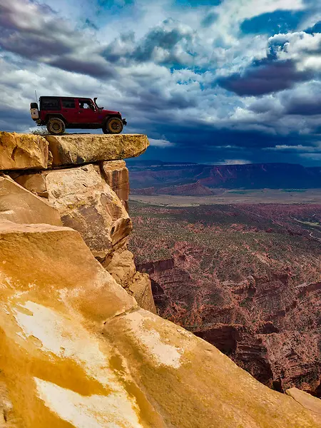 True influence is not defined by the four walls of an office or the polish of a professional setting; it is forged in the moments where the climb is steepest, and the obstacles are most daunting. Standing at the edge of the Top of the World trail in Moab, navigating a 1,500-foot elevation gain with a struggling engine, I am reminded that leadership is often about maintaining your composure when the machinery of life starts to sputter. The challenge was amplified by the sight of heavy thunder and lightning storms rolling in along the mountain horizons, a reminder that the environment we lead in is rarely predictable. Whether you are running a business from a kitchen table, navigating the high stakes of a hospital ward, or leading from a boardroom, the grit required to reach the summit remains the same even when the sky turns dark. This journey has always been about more than just the mechanical conquest; it is a tribute to the resilience I learned with my late dog, Odin, by my side for every mile of every storm. He taught me that being an influential woman means staying agile and refusing to turn back, even when the path is made of broken rock and the elements are closing in. Sometimes in life, you have no choice. You cannot turn back. Influence happens everywhere you have the courage to keep climbing despite the thunder, and the view from the top is always worth the struggle it took to get there.