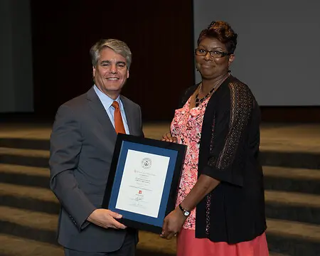 Receiving my 30 year Service Award from then the President of the University of Texas at Austin May 2016