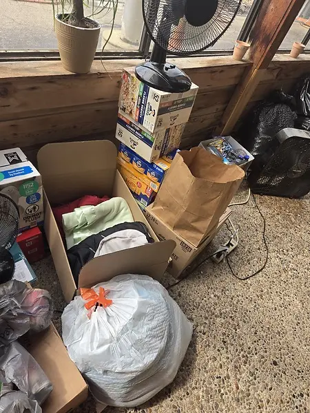 Behind the screen of supply drive for flood victims.July 2025