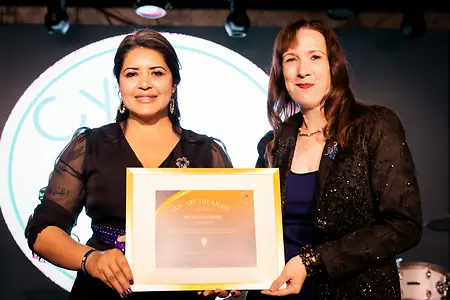Asal "Vox" Gibson presented Dr. Jessica Parker with a 𝗕𝗲 𝘁𝗵𝗲 𝗟𝗶𝗴𝗵𝘁 𝗔𝘄𝗮𝗿𝗱 in recognition of her leadership and stewardship and for her exceptional commitment to building and leading community programs that serve others. This award was presented at CyRoot Academy's one year anniversary event in January 2026.