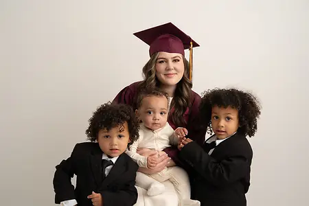 I am with my boys, and receiving my MBA. 