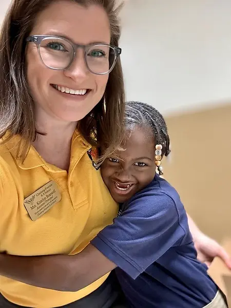 Receiving a hug from the distant student who found a bridge back to trust. 