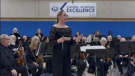 Speaking to the audience during concerts to connect history and culture. 