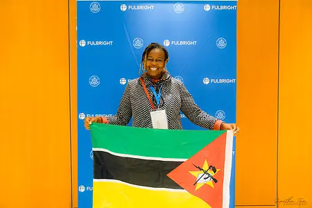 Holding the flag of Mozambique in front of a Fulbright backdrop represents an important part of my journey. I am proud to be a Fulbright Scholar from Mozambique, pursuing my PhD in Special Education at the University of Arizona. I am deeply grateful for this opportunity, not only for the education and experiences it has given me, but also for the opportunity to serve, give back, and inspire other women to believe in what is possible.