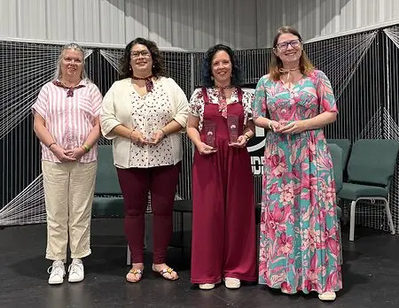 Sarah Manley, with the other former Presidents of the Laura Ingalls Wilder Legacy and Research Association receives the inaugural Neta Award for outstanding leadership and service to the LIWLRA at the Missouri Cherry Blossom Festival in Marshfield, MO in April 2026.
