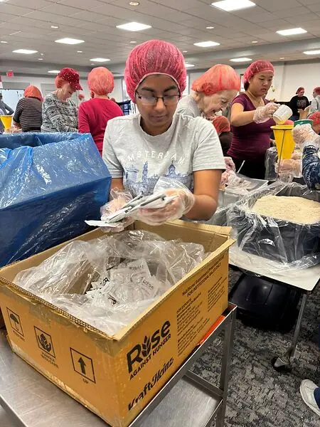 Volunteering for Rise Against Hunger at Williamsburg Presbyterian Church at Williamsburg, VA