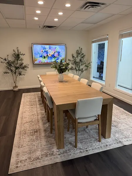 We have created a space that allows us to hold staff meetings and group therapy sessions. This table collapses, and we are able to set out group room chairs. This allows us to support our community and strengthen community relationships. 