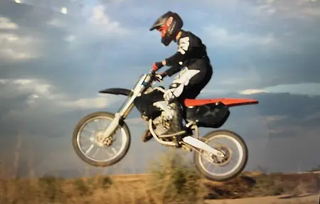 My son was enthralled with dirt biking from the young age of 6yrs old.  He was involved in many different areas of dirt biking, one of the most exciting was he raced at the monster truck show.  This picture is us just having fun out at the track.
