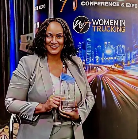 Dallas, TX – Nov. 15, 2022 – The Women In Trucking Association (WIT) presented Trina Norman, Southern California Feeder Operations Manager, UPS, with the 2022 Influential Woman in Trucking award. The award is sponsored by Daimler Truck North America (DTNA) and recognizes the achievements of female role models and trailblazers in the trucking industry.   “While all four finalists were exceptional, Trina Norman stood out due to her passion in giving back to her community while supporting her team and her company as she leads them toward success,” said Ellen Voie, WIT president and CEO.

Norman’s employment with UPS spans three decades where she has proven to be a well-rounded leader and a global citizen. She is a member of Delta Sigma Theta Sorority, Incorporated, where she has served as an activity member for 24 years. She also mentors and sponsors young college students to achieve their academic goals while attending college. 

Her mission is to recruit, empower, mentor, and encourage women to join the elite women behind the wheels at UPS. In 2019, Norman helped to lead the charge and was instrumental in charting the first Women in Operations business resource group in South Cal. In honor of her leadership and game-changing methodology, she was granted the game-changer award in March of 2022. In April of 2022, she was the recipient of the corporate trailblazer award for both Diversity, Equity and Inclusion, and Women In Operations. In July of 2022, she was the recipient of the Visionary Leader Award for excellence in undertaking extraordinary efforts to enhance the operational experience. “On behalf of Daimler Truck North America, a hearty ‘congratulations’ to Trina Norman for earning the recognition as the 2022 Influential Woman in Trucking,” said Kary Schaefer, chief engineer, cab systems and entire vehicle engineering at DTNA and WIT board member. “It was a remarkable field of nominees for this year’s award and all share the distinction of driving the trucking industry forward for all women.”