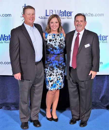 Leah Petrunak (center) pictured with LB Water Director of Sales & Marketing Bradd Everly (left) and CEO Shawn Pulford (right).