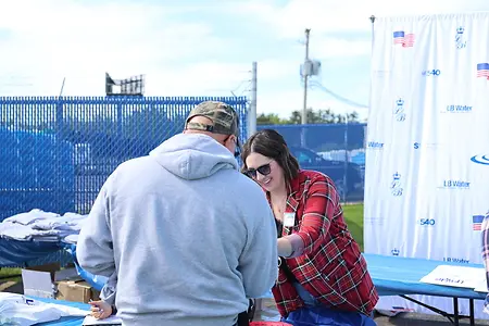 Leah Petrunak assists a customer during the grand opening of LB Water's Canton, Ohio, location after leading the marketing strategy and launch campaign for the company's newest branch.