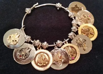 Service anniversary years at American Airlines are celebrated with AA Service Pins. This bracelet was designed to showcare the pins/charms.