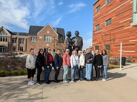 When this group came to Kansas City for a conference with H&R Block, they asked for a city tour. But after chatting with them about why they were in town, I thought—why not make the tour a little more personal?

Since H&R Block was founded right here in Kansas City, I added a few stories and stops connected to Henry Bloch and the company’s Kansas City roots. It was a fun way to connect their conference experience with the city they were visiting.

Henry Bloch’s legacy continues to be felt throughout Kansas City through the work of the H&R Block Foundation, which supports organizations and initiatives that strengthen our community and encourage entrepreneurship.

That’s one of my favorite things about creating tours for groups: you don’t always have to follow the same script. Sometimes the best tours come from learning why a group is here and finding a Kansas City story that connects to them.

A city tour can be more than a list of landmarks. It can be their Kansas City story.
