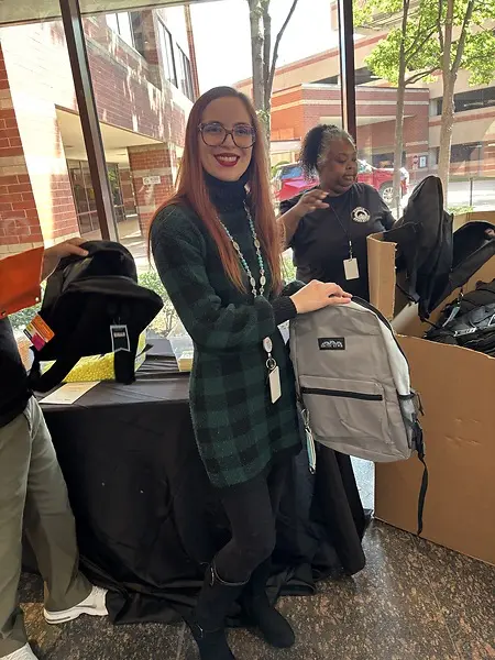 Giving back through AT&T’s Bridge to Possibility campaign by helping pack backpacks filled with school supplies for students in need.