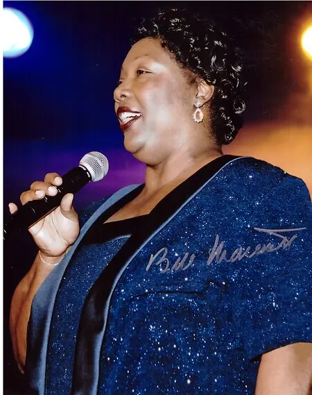 Barbara Washington performing God Bless America at invitation of J. W. Marriott Jr. at opening of the St. Louis Convention Center