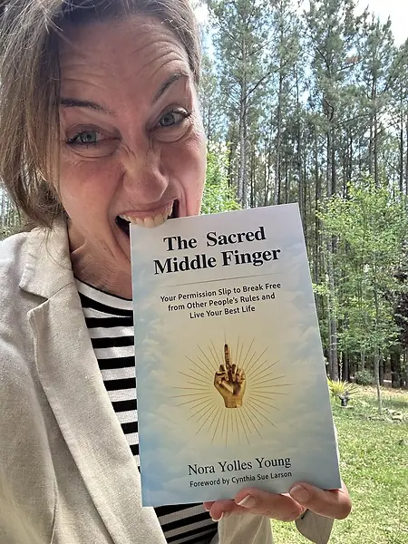 Meet my Amazon #1 Best Selling Book.

The Sacred Middle Finger: Your Permission Slip to Break Free from Other People's Rules and Live Your Best Life.

This book isn't about rebellion for rebellion's sake.

It's about developing the courage to think for yourself, trust your inner knowing, and create a life that reflects who you genuinely are.

And yes... I had to have a little fun with the photo.