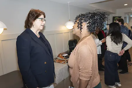 Mary Lou Panzano getting to know conference attendees before a keynote talk. 