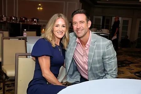 Amie, and her husband, Matt, attending a sales award ceremony