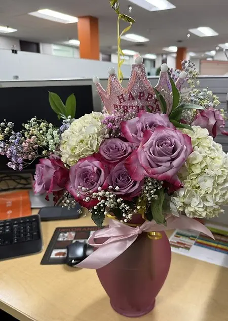 This is my team showing me they care.  It was my birthday last week and I spent it flying to TX for an on-site team visit.  I was surprised by the amazing bouquet and my very own birthday tiara...along with my favorite treat, ice cream.  So lucky to have a thoughtful and supporting work-family.