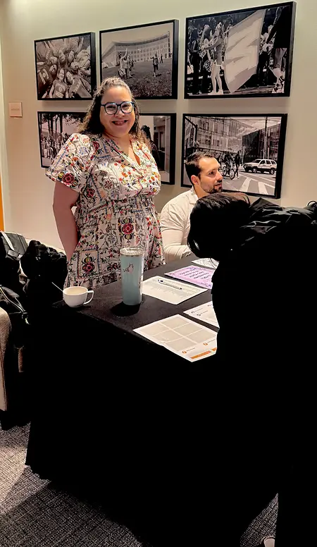 Supporting ALPFA Boston at an event by greeting guests and checking people in. 