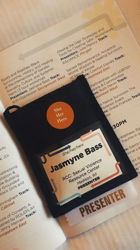 Day 1 National Sexual Assault Conference: My presenter badge and name and workshop in the conference program.