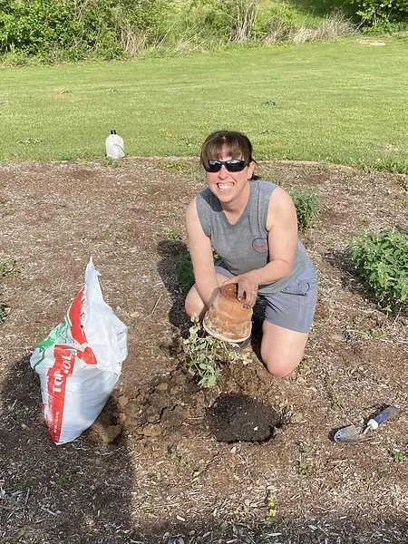 Planting more herbs for our products.