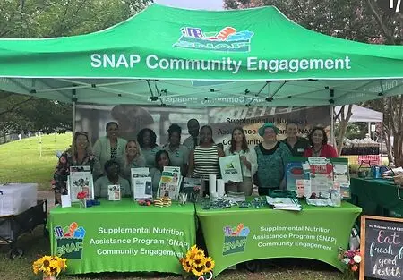 This photo captures a special milestone: celebrating 15 years of SNAP EBT access at farmers markets in Virginia during Virginia Farmers Market Week, an occasion recognized with a Certificate of Recognition from the Governor of Virginia. I was joined by members of our SNAP Community Engagement team and community partners who have helped make this work possible.

For me, the moment represents what public service is really about. Policy, technology, budgets, and program administration are essential, but their value is ultimately measured by what happens when they reach a community. Farmers markets are one example of how we can connect nutrition assistance, healthy food access, local agriculture, and community engagement in a very tangible way.

Being present in these spaces also gives us an opportunity to listen, learn, build relationships, and better understand the experiences of the people we serve. And this celebration was a reminder that meaningful change is never the work of one person. Behind every successful program is a network of dedicated staff, partners, advocates, and community members who turn policy into something that makes a difference in people's lives.

This is where the work becomes real.