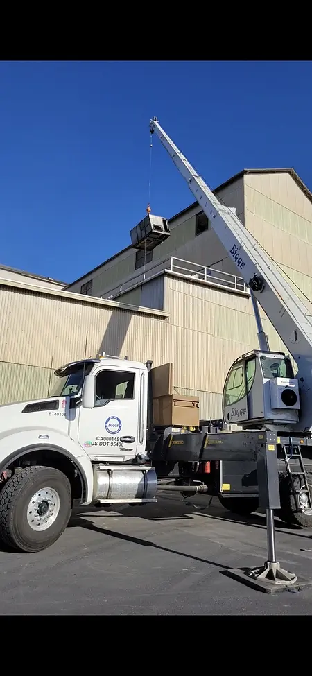 Active crane pick to remove an old HVAC unit and get ready to install the new one