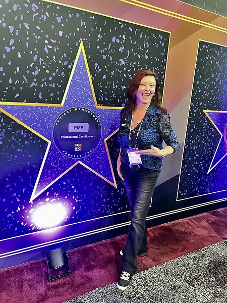 Valorie celebrating the project management profession at a PMI Global Summit, reflecting her longtime commitment to professional development, leadership, and the project management community.