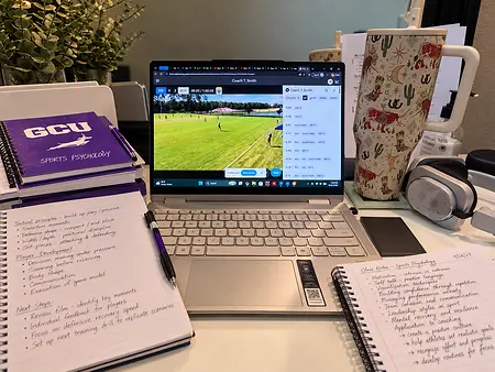 Game film on the screen, sports psych notes on the desk, coffee within reach. were coaching meets psychology is where I do my best work, because developing players means training the mind as much as the feet