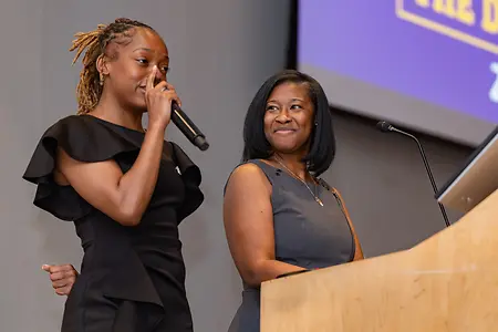 Spring 2026 Multicultural "The Donning" Celebration. 

The Donning celebrates the achievements of students in their final stage of matriculation at James Madison University. This event honors students who have actively engaged with CMSS student organizations, programs, and services during their time at JMU. Participants will receive a stole to wear during the JMU commencement exercises.

Pictured Left to Right: Amiya Reese-Banks (CMSS Student Leader) and Dr. Brittani Staley, LMSW hosting the program.