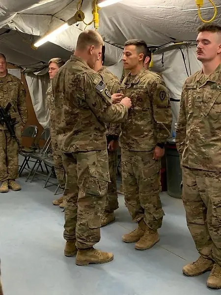 This photo captures one of the proudest moments of my Army career as an NCO. The Soldier I’m pinning Sergeant rank on was someone I had the privilege of mentoring from the time he was a PFC. He was there through countless training rotations in Alaska and California, and later deployed with me to Iraq, where I watched him put into practice the skills, discipline, and confidence that our team had worked to develop in him.

Seeing him earn the rank of Sergeant meant more to me than simply watching a Soldier get promoted. He was the first person I had the opportunity to mentor from a junior Soldier into an NCO, and his success showed me the kind of leader, mentor, and teacher I wanted to continue becoming.

What makes this photo even more meaningful is where it was taken: inside our aid station in Iraq. That was a place where we worked side by side caring for patients, saving lives, and training other medics to become more capable and confident in their own careers. Leadership there was never just about rank or authority. It was about preparing the people around you to perform when it mattered most and helping them grow into leaders themselves.

This moment has stayed with me because it reinforced one of the most important lessons I took from the Army: a leader’s success is measured in part by the people they develop and the leaders they leave behind. That is a standard I have carried with me ever since.